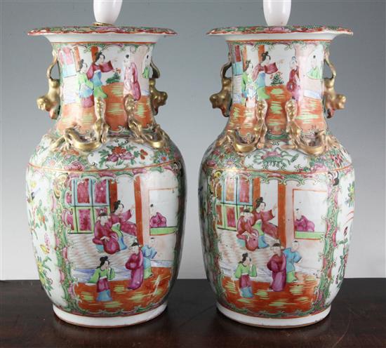A pair of Chinese Canton-decorated vases, late 19th century, height 34.5cm, removable lamp fittings